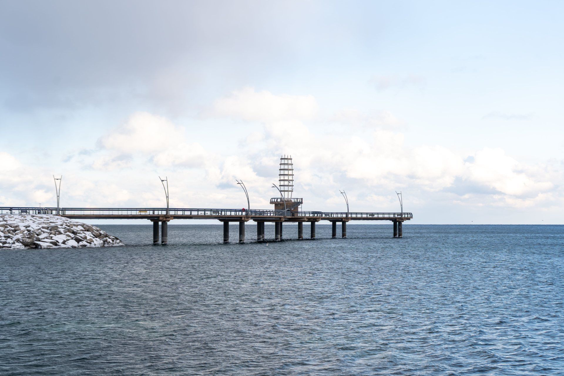 The Brant Street Pier in Burlington curving out over Lake Ontario on a winter day